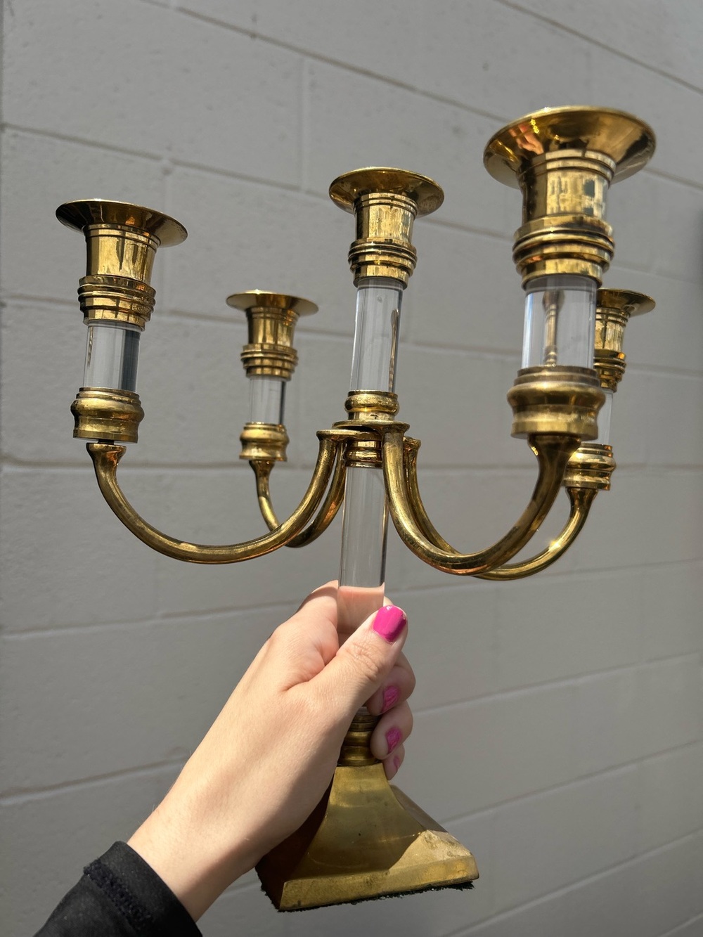 vintage Hollywood Regency candelabra featuring brass arms and lucite accents